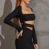 Enya Langarm-Minikleid mit Cut-outs in Schwarz Enya Langarm-Minikleid mit Cut-outs in Schwarz