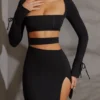 Enya Langarm-Minikleid mit Cut-outs in Schwarz Enya Langarm-Minikleid mit Cut-outs in Schwarz