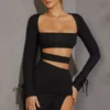 Enya Langarm-Minikleid mit Cut-outs in Schwarz Enya Langarm-Minikleid mit Cut-outs in Schwarz