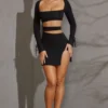 Enya Langarm-Minikleid mit Cut-outs in Schwarz Enya Langarm-Minikleid mit Cut-outs in Schwarz