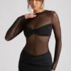 Essie Transparentes Minikleid mit Einsätzen und langen Ärmeln in Schwarz