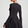 Fiorella Langarm-Plissee-Minikleid in Schwarz Fiorella Langarm-Plissee-Minikleid in Schwarz