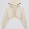 Gebürsteter Jersey-Cropped-Shrug mit Kapuze in Ecru Gebürsteter Jersey-Cropped-Shrug mit Kapuze in Ecru