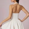 Haddie Modal-Minikleid mit Broderie Anglaise und Neckholder-Ausschnitt in Weiß Haddie Modal-Minikleid mit Broderie Anglaise und Neckholder-Ausschnitt in Weiß