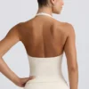 Halter-Oberteil mit offenem Rücken in Elfenbein-Mélange Halter-Oberteil mit offenem Rücken in Elfenbein-Mélange