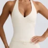 Halter-Oberteil mit offenem Rücken in Elfenbein-Mélange Halter-Oberteil mit offenem Rücken in Elfenbein-Mélange