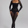 Irina Langarm-Jumpsuit aus nahtlosem Strick in Schwarz Irina Langarm-Jumpsuit aus nahtlosem Strick in Schwarz