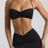 Jerika Slinky Jersey Bralette mit Metallverzierung und Neckholder-Ausschnitt in Schwarz