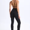 Kiki Modal Plunge Jumpsuit mit offenem Rücken und ausgestelltem Schnitt in Schwarz Kiki Modal Plunge Jumpsuit mit offenem Rücken und ausgestelltem Schnitt in Schwarz