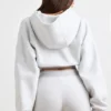 Kürzer Hoodie aus Stretch-Baumwollfleece in Grau meliert Kürzer Hoodie aus Stretch-Baumwollfleece in Grau meliert