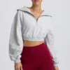 Kürzliches Sweatshirt mit Viertelreißverschluss in Grau meliert Kürzliches Sweatshirt mit Viertelreißverschluss in Grau meliert