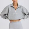 Kürzliches Sweatshirt mit Viertelreißverschluss in Grau meliert Kürzliches Sweatshirt mit Viertelreißverschluss in Grau meliert