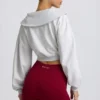 Kürzliches Sweatshirt mit Viertelreißverschluss in Grau meliert Kürzliches Sweatshirt mit Viertelreißverschluss in Grau meliert