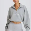 Kürzliches Sweatshirt mit Viertelreißverschluss in Grau meliert Kürzliches Sweatshirt mit Viertelreißverschluss in Grau meliert