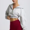 Kürzliches Sweatshirt mit Viertelreißverschluss in Grau meliert Kürzliches Sweatshirt mit Viertelreißverschluss in Grau meliert