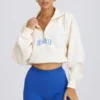 Kürzliches Sweatshirt mit Viertelreißverschluss in Weiß Kürzliches Sweatshirt mit Viertelreißverschluss in Weiß