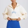 Kürzliches Sweatshirt mit Viertelreißverschluss in Weiß Kürzliches Sweatshirt mit Viertelreißverschluss in Weiß