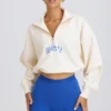 Kürzliches Sweatshirt mit Viertelreißverschluss in Weiß Kürzliches Sweatshirt mit Viertelreißverschluss in Weiß