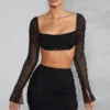 La Desirade Crop-Top mit verziertem Wasserfallausschnitt in Schwarz