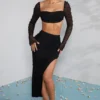 La Desirade Crop-Top mit verziertem Wasserfallausschnitt in Schwarz
