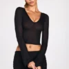 Liah Transparentes Jersey-Oberteil mit tiefem Ausschnitt und langen Ärmeln in Schwarz Liah Transparentes Jersey-Oberteil mit tiefem Ausschnitt und langen Ärmeln in Schwarz