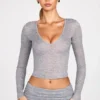 Liah Transparentes Jersey-Plunge-Oberteil mit langen Ärmeln in Grau Liah Transparentes Jersey-Plunge-Oberteil mit langen Ärmeln in Grau