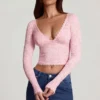 Lioren Transparentes Spitzen-Oberteil mit tiefem Ausschnitt und langen Ärmeln in Rosa Lioren Transparentes Spitzen-Oberteil mit tiefem Ausschnitt und langen Ärmeln in Rosa