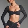 Lumina verziertes langärmeliges Crop-Top in Schwarz Lumina verziertes langärmeliges Crop-Top in Schwarz