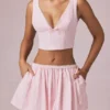Magda Crop-Top mit Schleifendetail in zartem Mauve-Streifen Magda Crop-Top mit Schleifendetail in zartem Mauve-Streifen