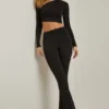 Mairead Asymmetrisch drapierte, ausgestellte Hose mit mittlerer Leibhöhe in Schwarz Mairead Asymmetrisch drapierte, ausgestellte Hose mit mittlerer Leibhöhe in Schwarz