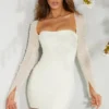 Milan Langarm-Minikleid mit Verzierungen in Elfenbein Milan Langarm-Minikleid mit Verzierungen in Elfenbein