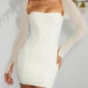 Milan Langarm-Minikleid mit Verzierungen in Elfenbein Milan Langarm-Minikleid mit Verzierungen in Elfenbein
