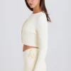 Mini-Shorts aus geripptem Strick mit Bindeband in Creme