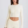 Mini-Shorts aus geripptem Strick mit Bindeband in Creme