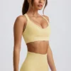 Nahtloser Super Sculpt Sport-BH mit gekreuzten Trägern in Buttergelb