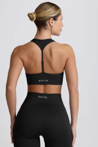 Nahtloser Super Sculpt T-Back-Sport-BH in Schwarz