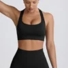 Nahtloser Super Sculpt T-Back-Sport-BH in Schwarz Nahtloser Super Sculpt T-Back-Sport-BH in Schwarz
