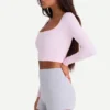 Nahtloses, weiches Rippstrick-Oberteil mit Cut-outs in Puderrosa Nahtloses, weiches Rippstrick-Oberteil mit Cut-outs in Puderrosa