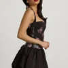 Nanala Neckholder-Minikleid mit Schnürung und Bubble-Saum in Schwarz mit Blumenprint