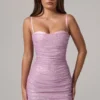 Neréa Minikleid mit Rüschen und Peekaboo-Ausschnitt in Rosa Neréa Minikleid mit Rüschen und Peekaboo-Ausschnitt in Rosa