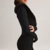 Nesta Playsuit mit Kunstfellbesatz in Schwarz Nesta Playsuit mit Kunstfellbesatz in Schwarz