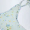 Nieva String-Bikinihose mit seitlichen Bändern in Blau mit Blumenmuster Nieva String-Bikinihose mit seitlichen Bändern in Blau mit Blumenmuster