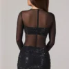 Noel transparentes, verziertes Minikleid mit hohem Kragen und langen Ärmeln in Schwarz Noel transparentes, verziertes Minikleid mit hohem Kragen und langen Ärmeln in Schwarz