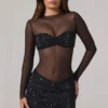 Noel transparentes, verziertes Minikleid mit hohem Kragen und langen Ärmeln in Schwarz Noel transparentes, verziertes Minikleid mit hohem Kragen und langen Ärmeln in Schwarz
