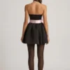 Norina Minikleid mit Schleifendetail und Korsettoptik in Schwarz Norina Minikleid mit Schleifendetail und Korsettoptik in Schwarz