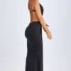 Omarosa Maxikleid mit Metallverzierungen und Cut-outs im Neckholder-Stil in Schwarz Omarosa Maxikleid mit Metallverzierungen und Cut-outs im Neckholder-Stil in Schwarz