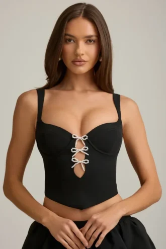 Pearla Korsett-Oberteil mit Cut-outs und Schleifendetail in Schwarz