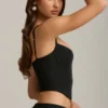 Pearla Korsett-Oberteil mit Cut-outs und Schleifendetail in Schwarz Pearla Korsett-Oberteil mit Cut-outs und Schleifendetail in Schwarz
