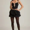 Pearla Korsett-Oberteil mit Cut-outs und Schleifendetail in Schwarz Pearla Korsett-Oberteil mit Cut-outs und Schleifendetail in Schwarz