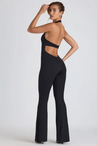 Pema Modal-Jumpsuit mit Spitzenbesatz, Cut-outs und ausgestelltem Schnitt in Schwarz